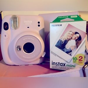 Instax mini 11 camera. Case adjustable strap. Film. Used twice great condition.